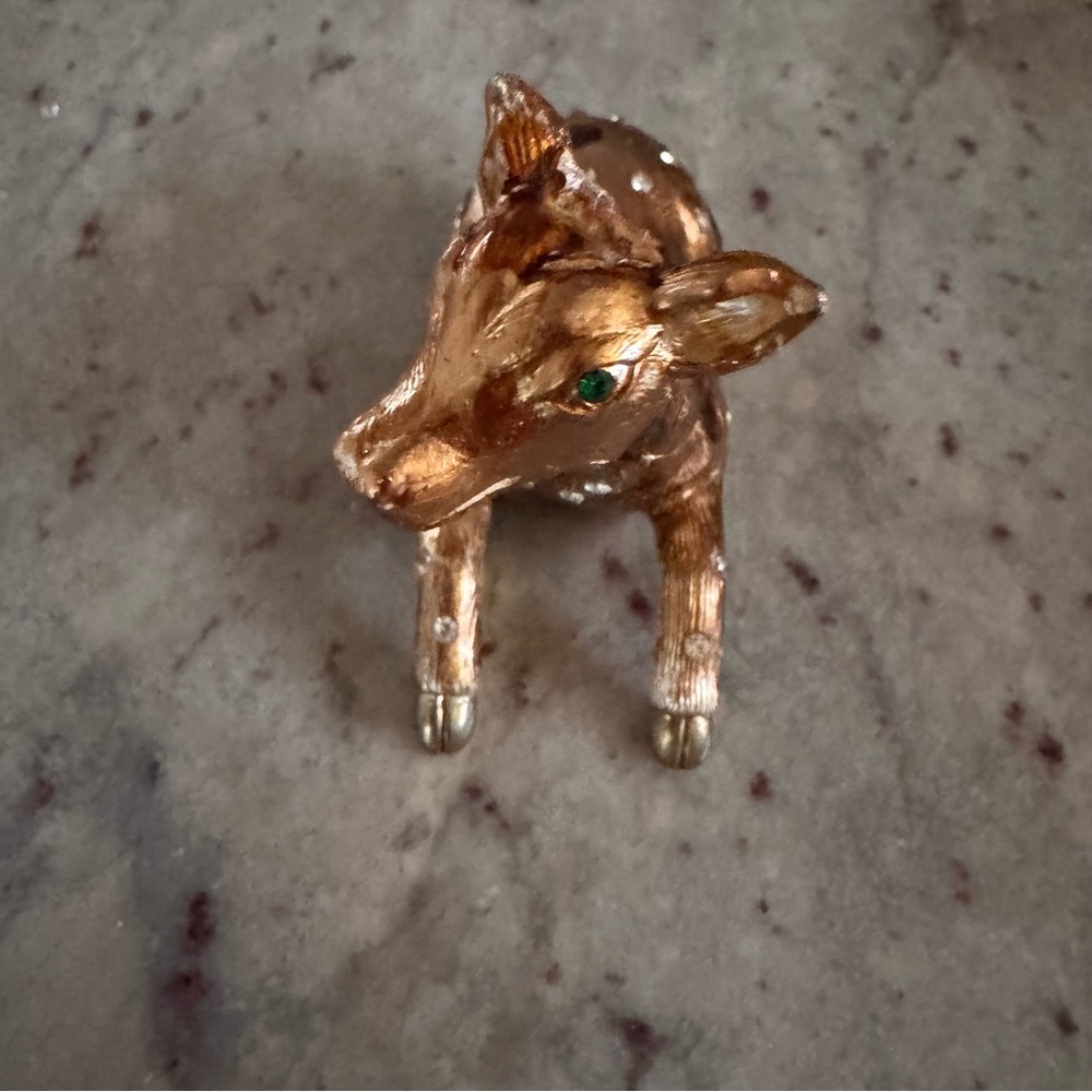bronze and brown cow trinket